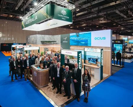 The Australian delegation gathered at the pavilion stand
